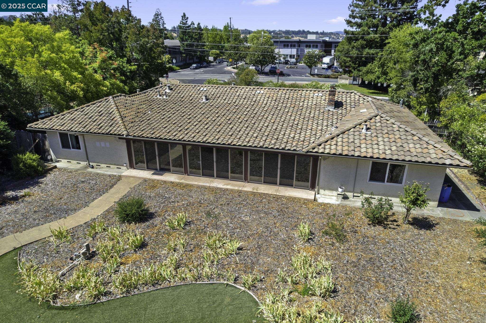 1910 San Miguel Drive Walnut Creek, CA 94596 - Photo 46 of 58 a front view of a house with garden