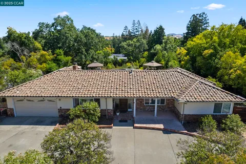 a bedroom with a bed and chair