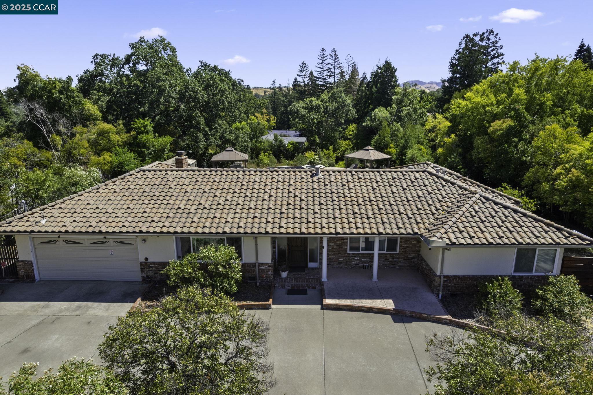 1910 San Miguel Drive Walnut Creek, CA 94596 - Photo 47 of 58 a front view of a house with garden