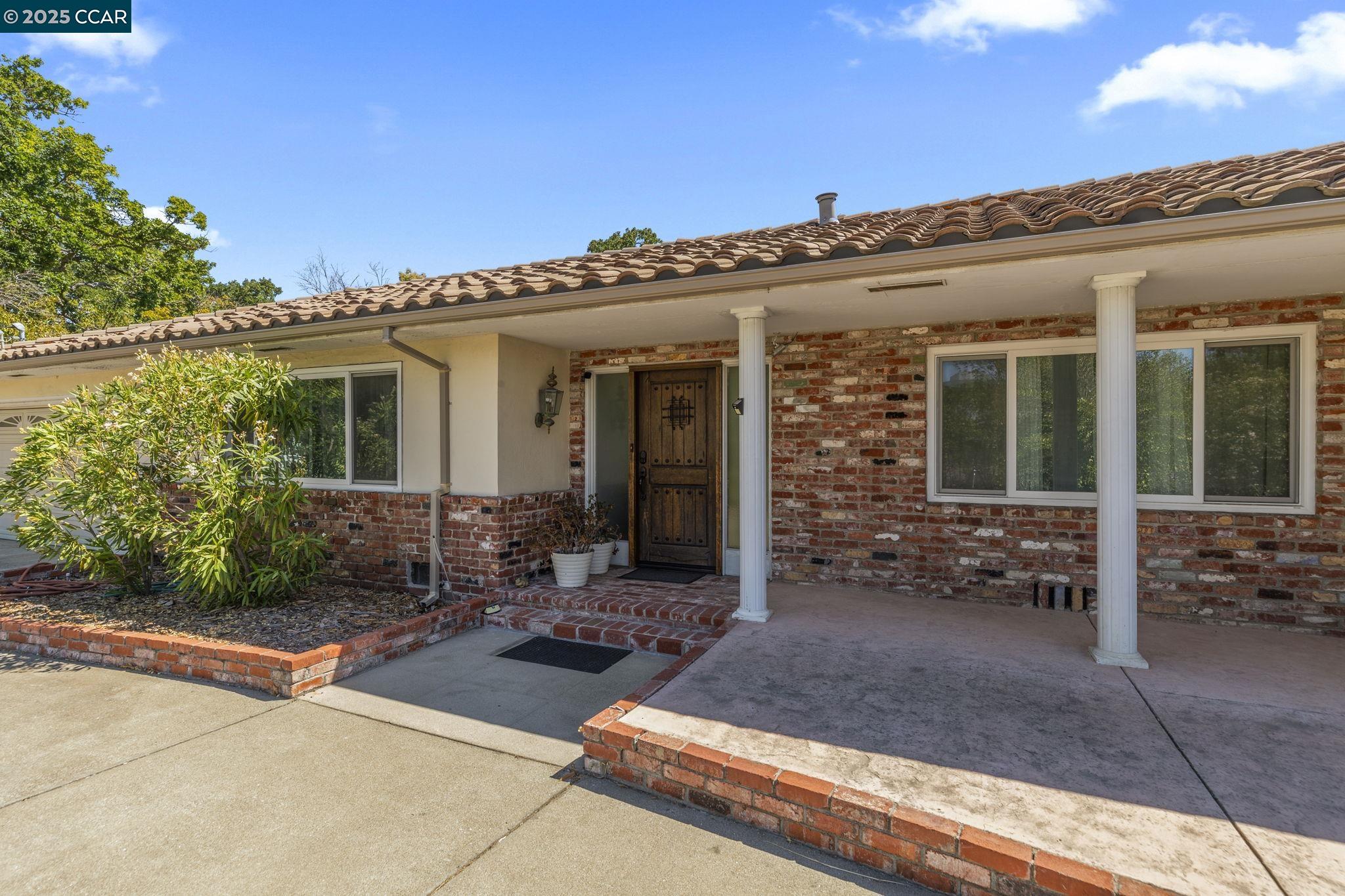 1910 San Miguel Drive Walnut Creek, CA 94596 - Photo 5 of 58 a view of a house with patio