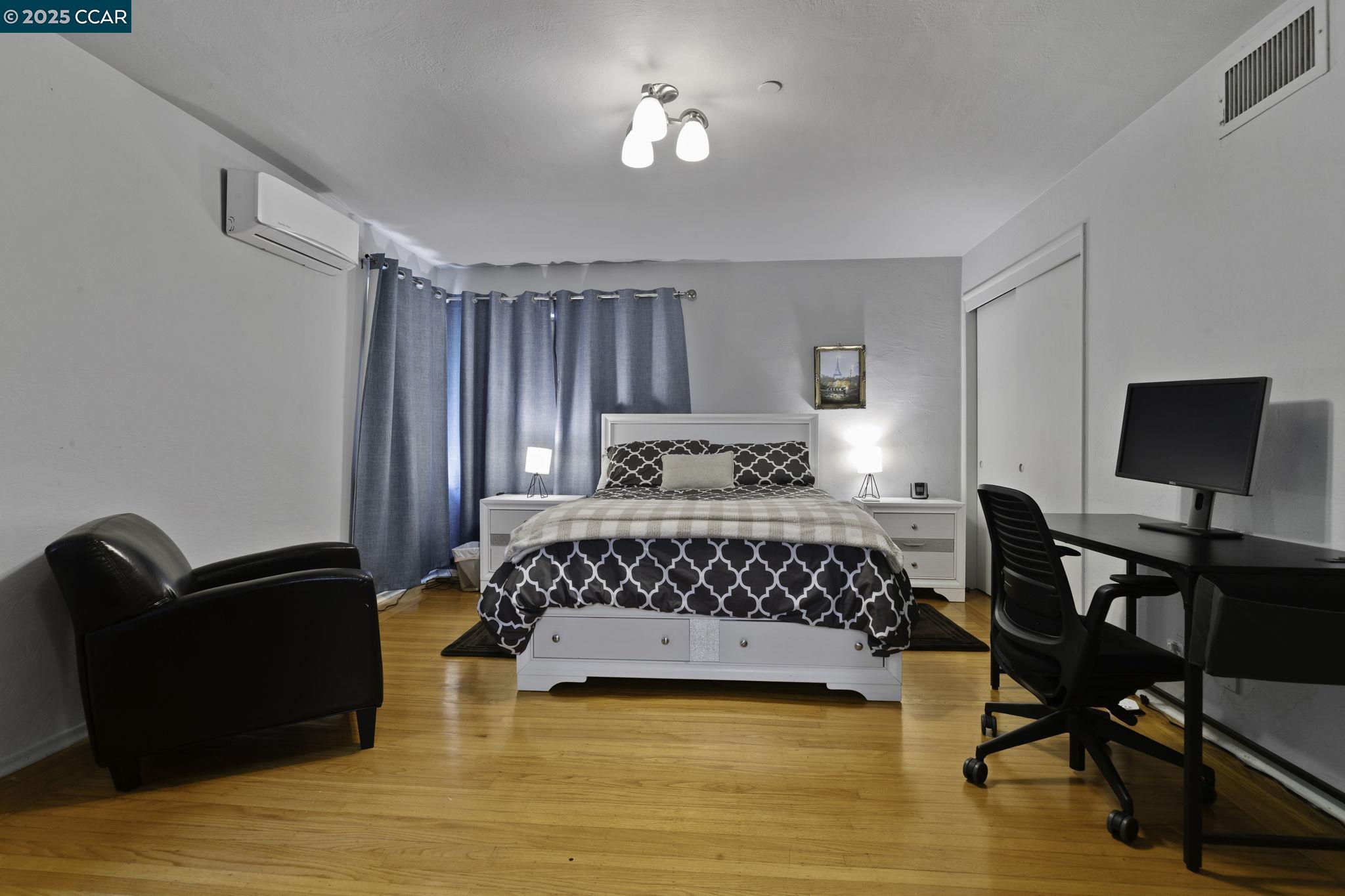 1910 San Miguel Drive Walnut Creek, CA 94596 - Photo 55 of 58 a bedroom with a bed and chair