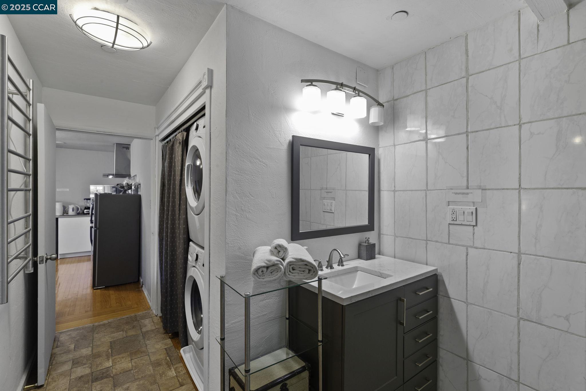 1910 San Miguel Drive Walnut Creek, CA 94596 - Photo 57 of 58 a bathroom with a sink vanity and a mirror