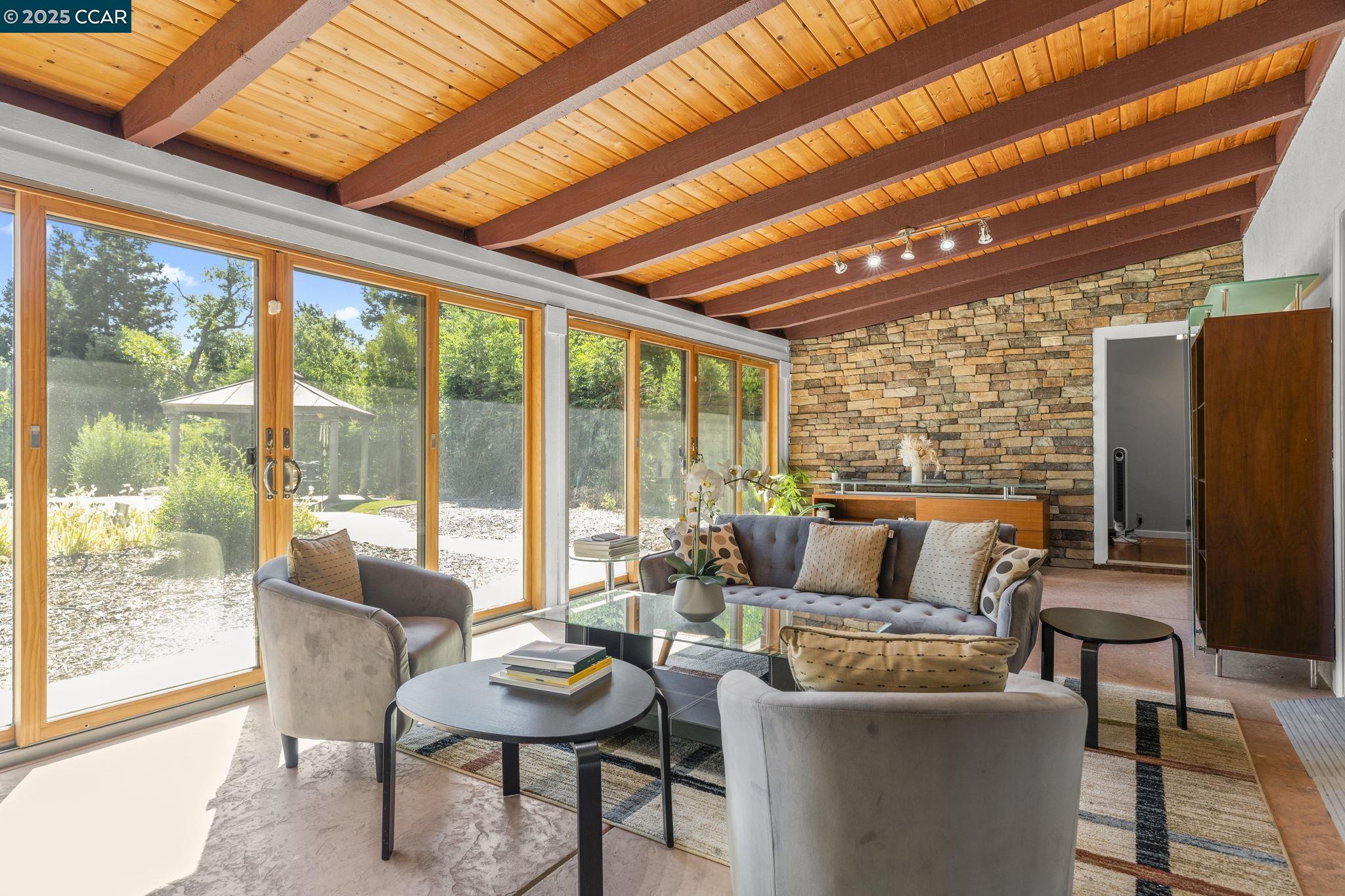 1910 San Miguel Drive Walnut Creek, CA 94596 - Photo 8 of 58 a living room with furniture and a floor to ceiling window