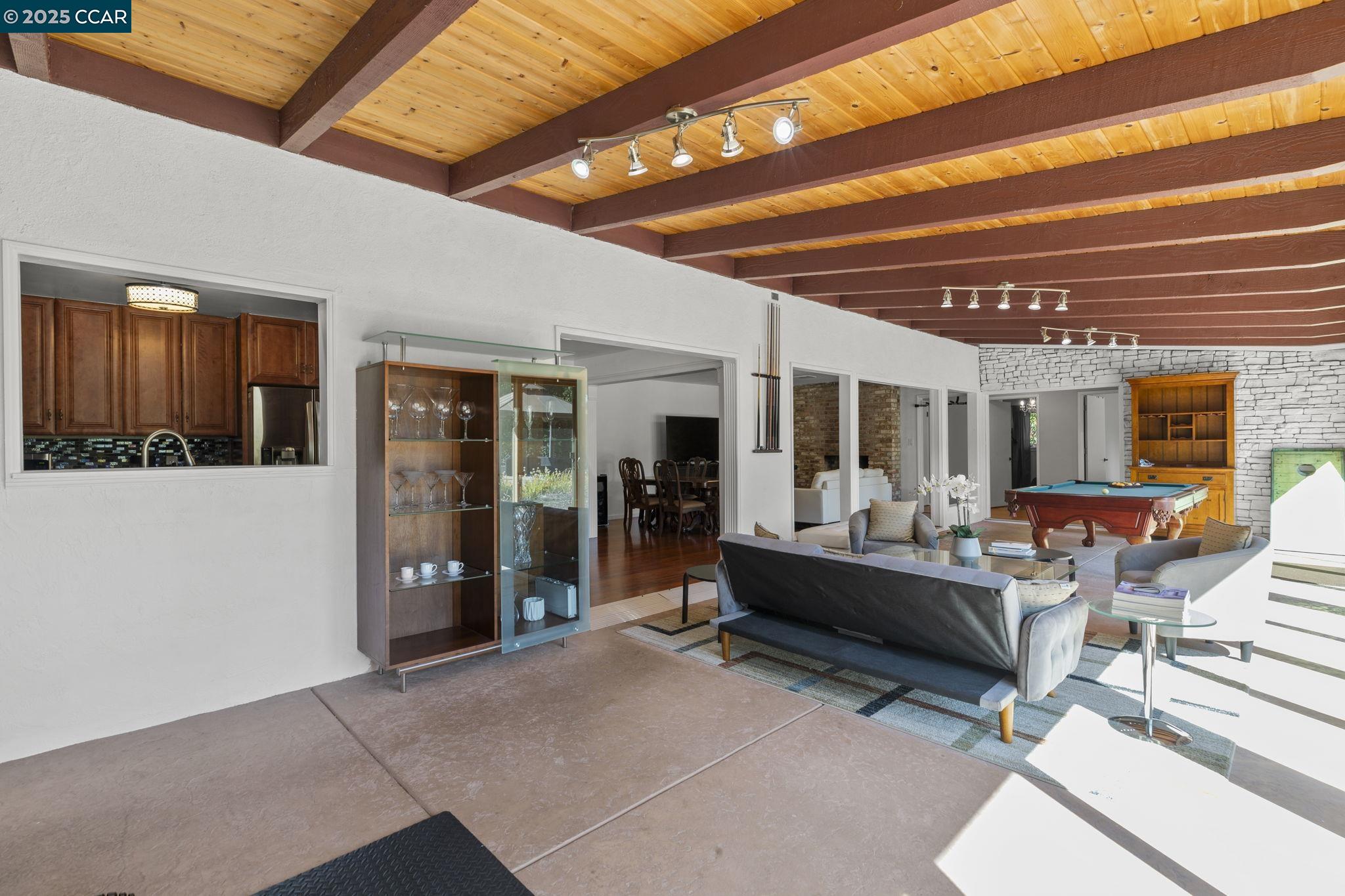 1910 San Miguel Drive Walnut Creek, CA 94596 - Photo 10 of 58 a living room with patio furniture and a large window