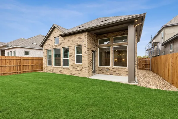 a view of a house with yard and front view of a house