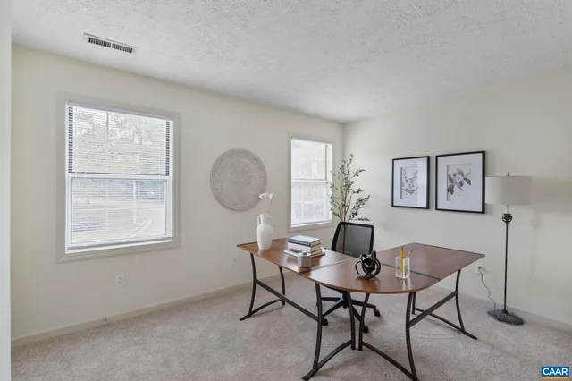 a workspace with furniture and window