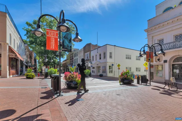a view of path along with retail shop and buildings