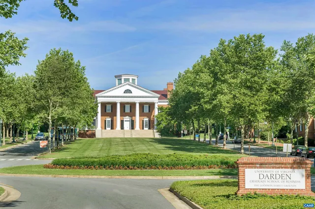 front view of a brick house with a clock on the wall
