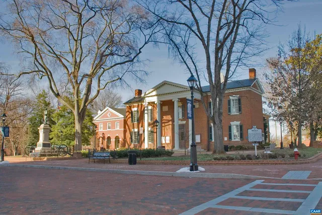 a sign board with yard and lake view