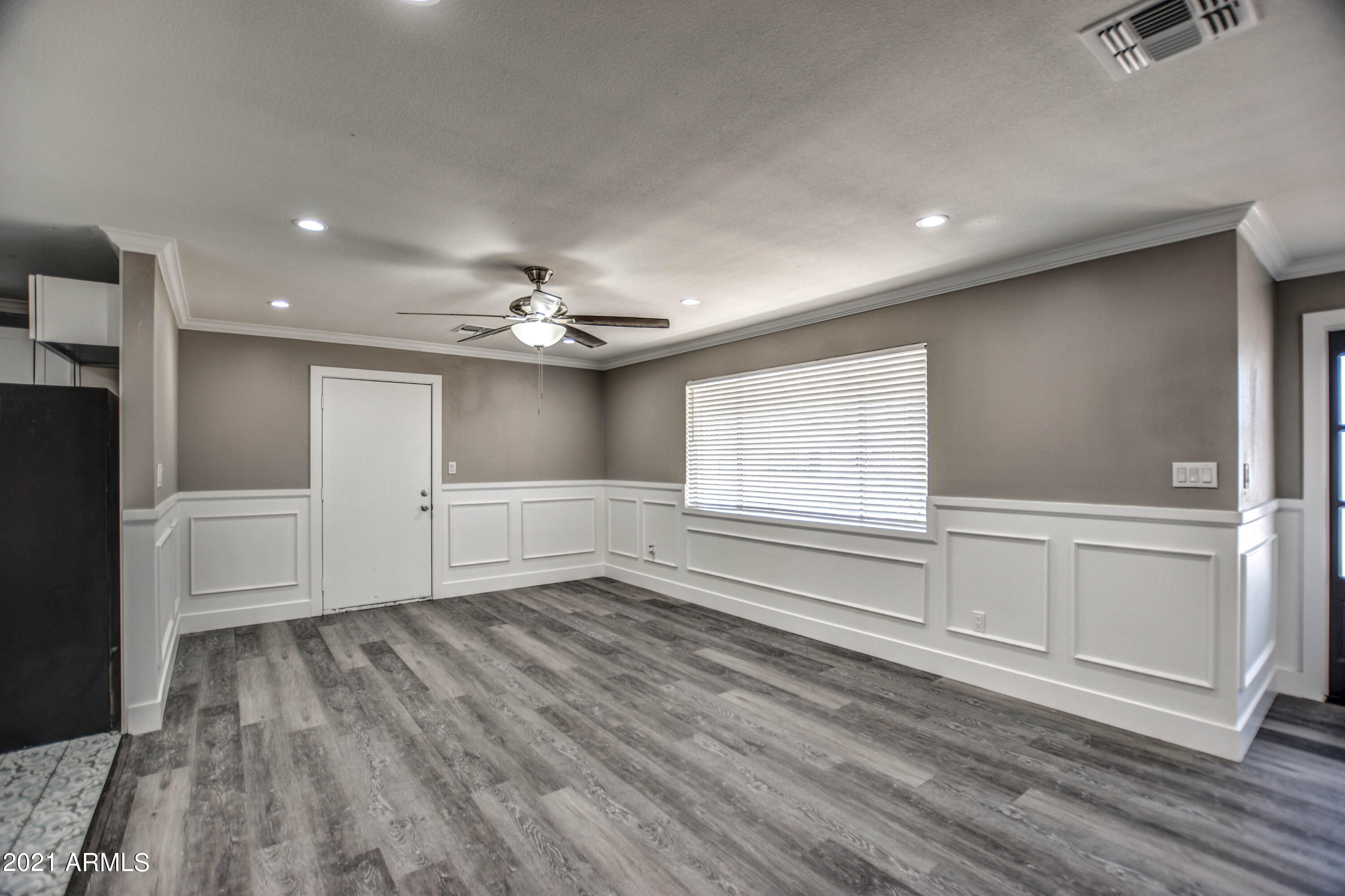 5743 Casper Road Mesa, AZ 85205 - Photo 20 of 43 wooden floor in an empty room with a window