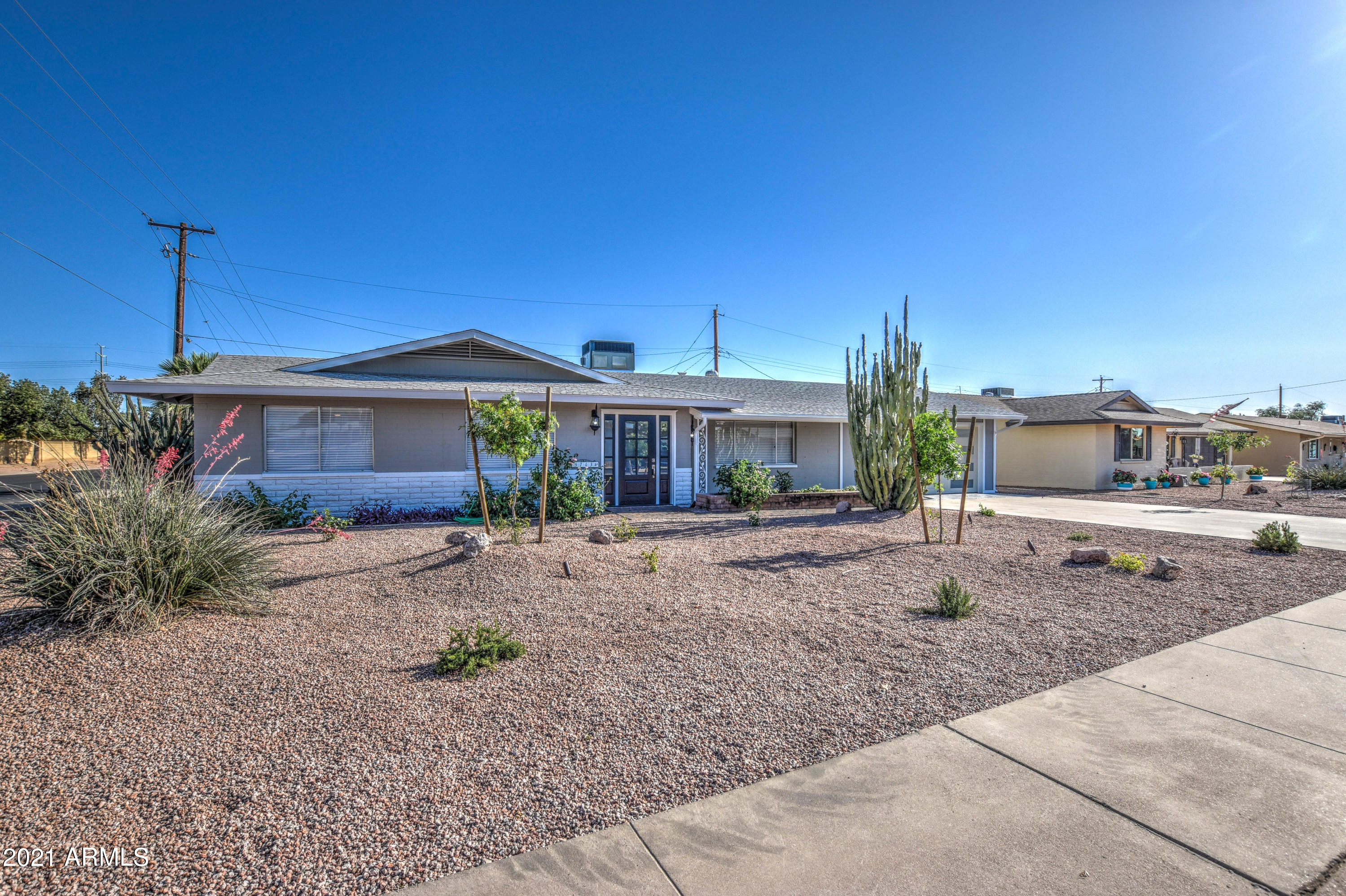 5743 Casper Road Mesa, AZ 85205 - Photo 22 of 43 a front view of a house with garden