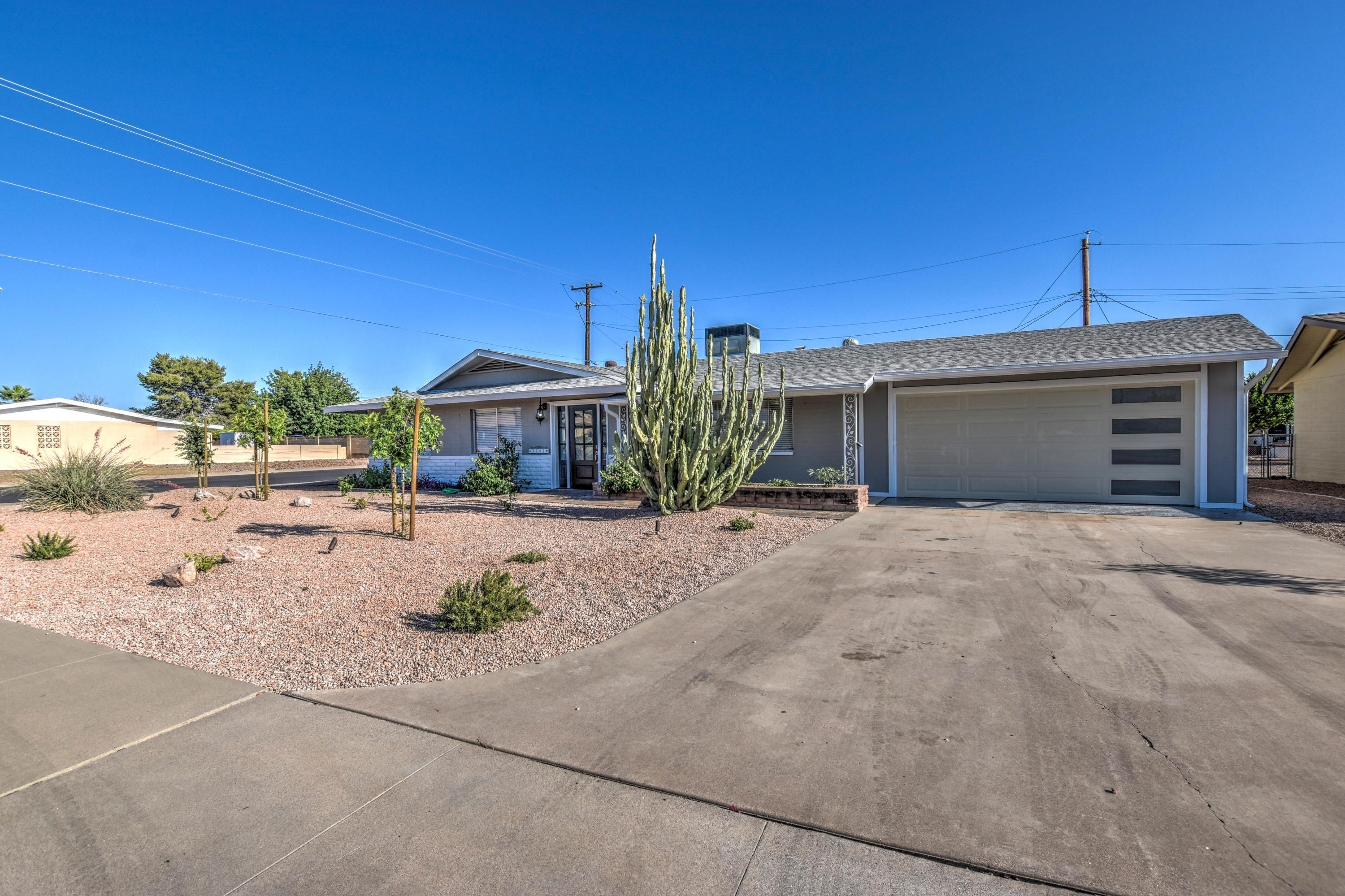 5743 Casper Road Mesa, AZ 85205 - Photo 24 of 43 a front view of a house with a yard and garage