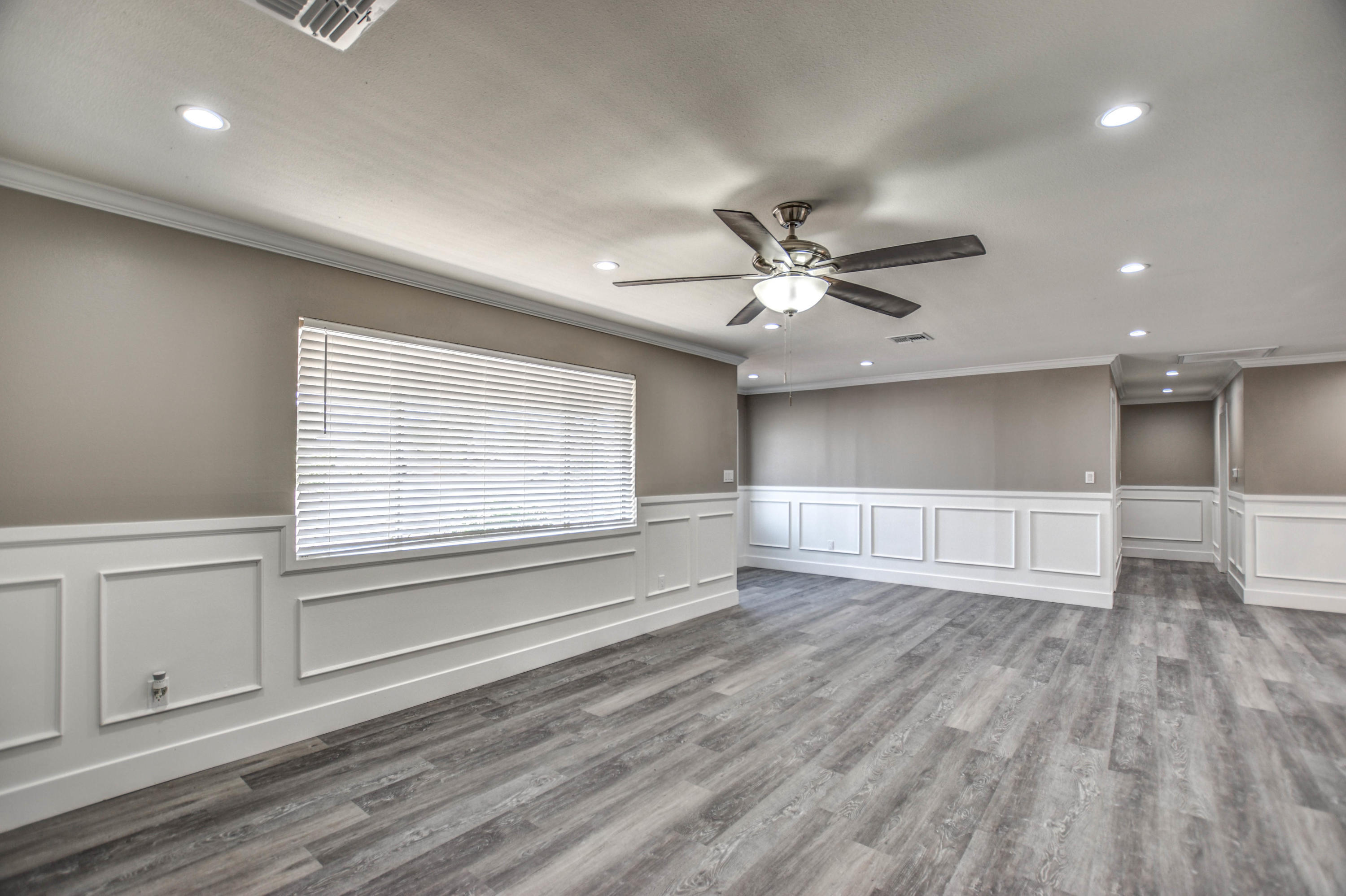 5743 Casper Road Mesa, AZ 85205 - Photo 30 of 43 a view of an empty room with a window and wooden floor
