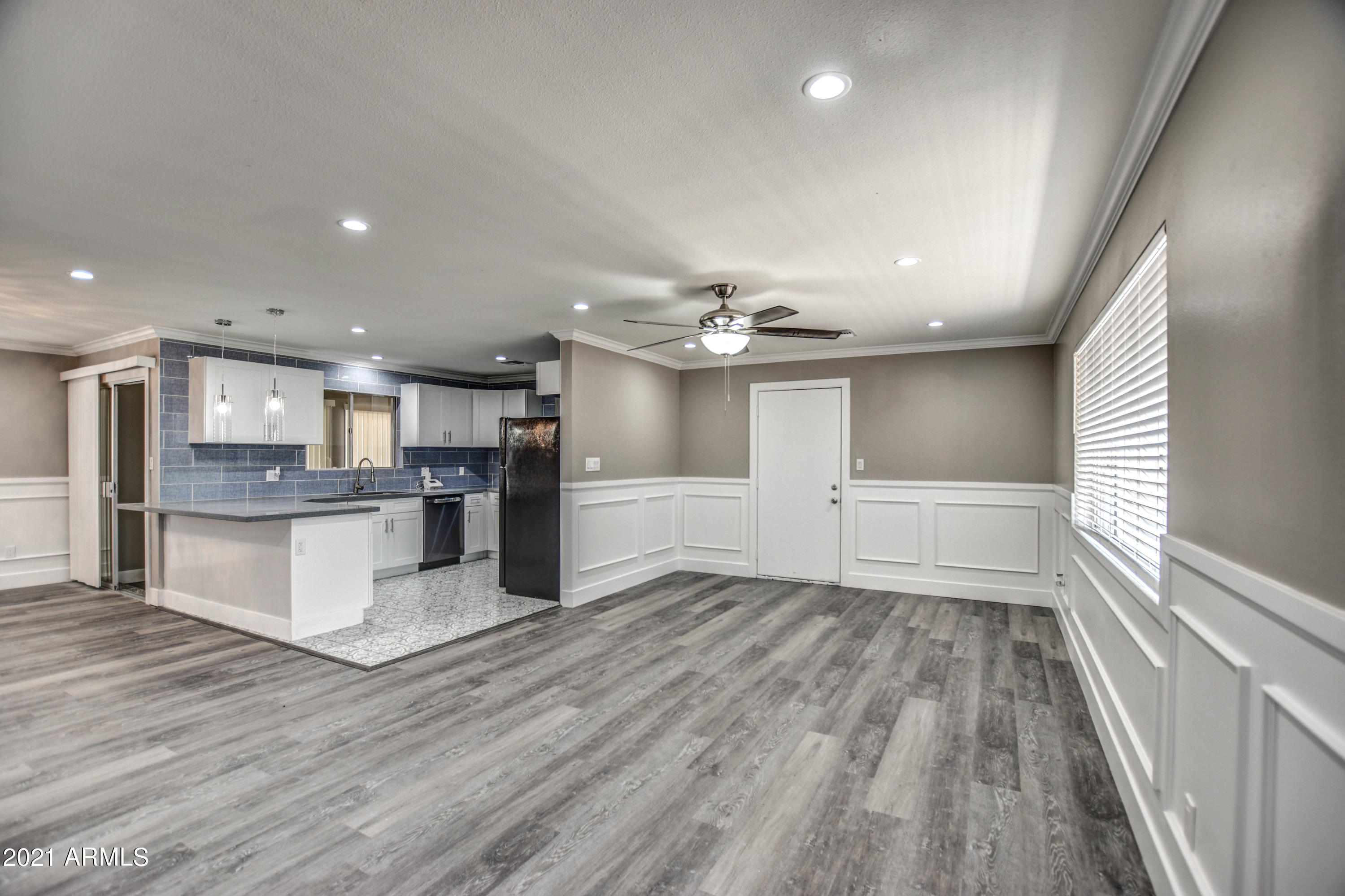 5743 Casper Road Mesa, AZ 85205 - Photo 32 of 43 a view of kitchen with cabinets and wooden floor