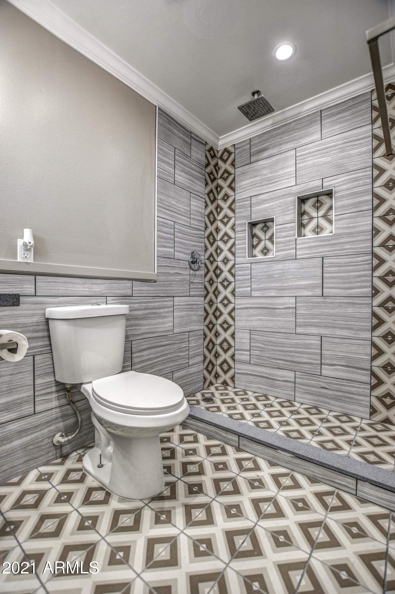 5743 Casper Road Mesa, AZ 85205 - Photo 38 of 43 a bathroom with a toilet and a shower
