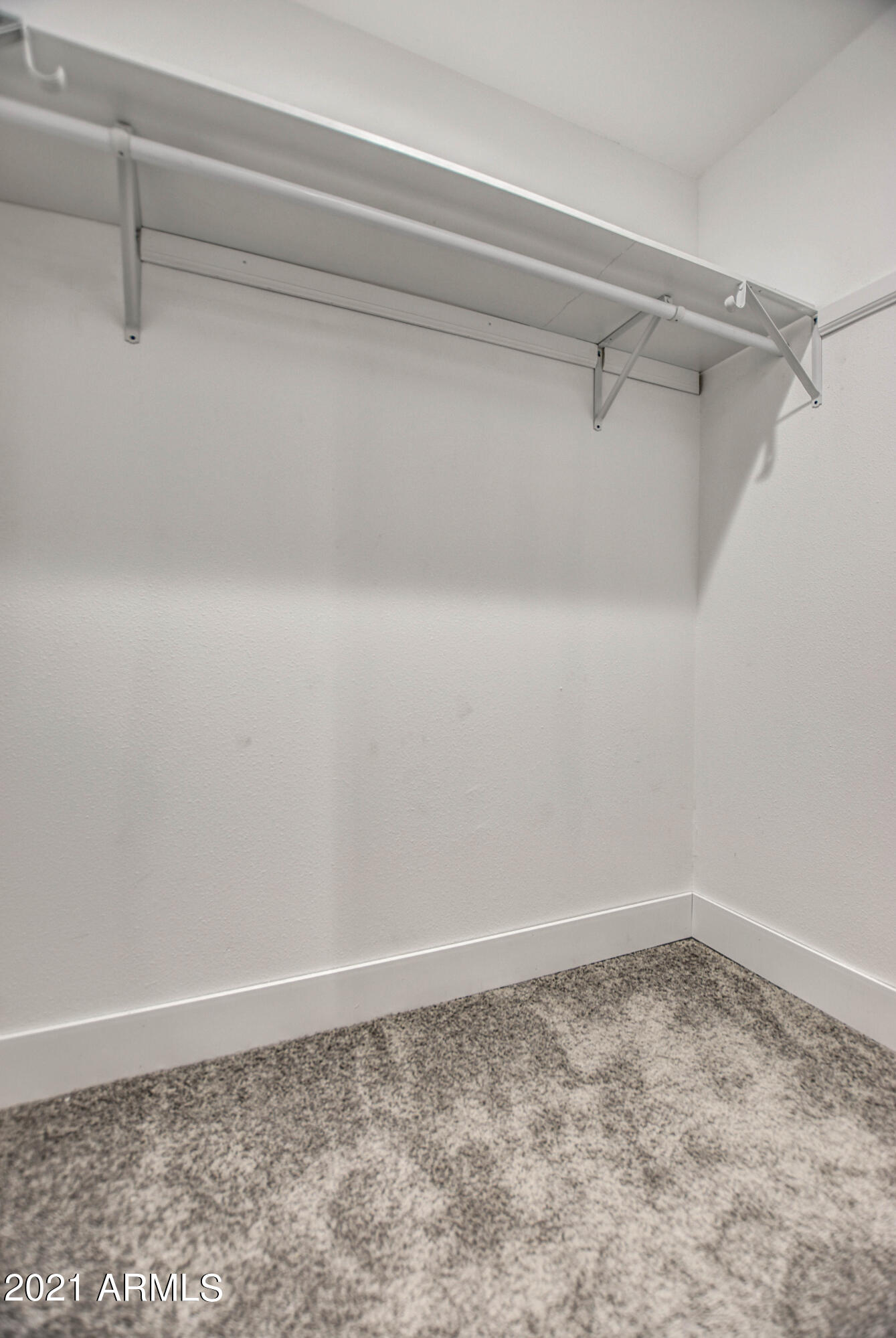 5743 Casper Road Mesa, AZ 85205 - Photo 39 of 43 a view of a room with racks on the wall