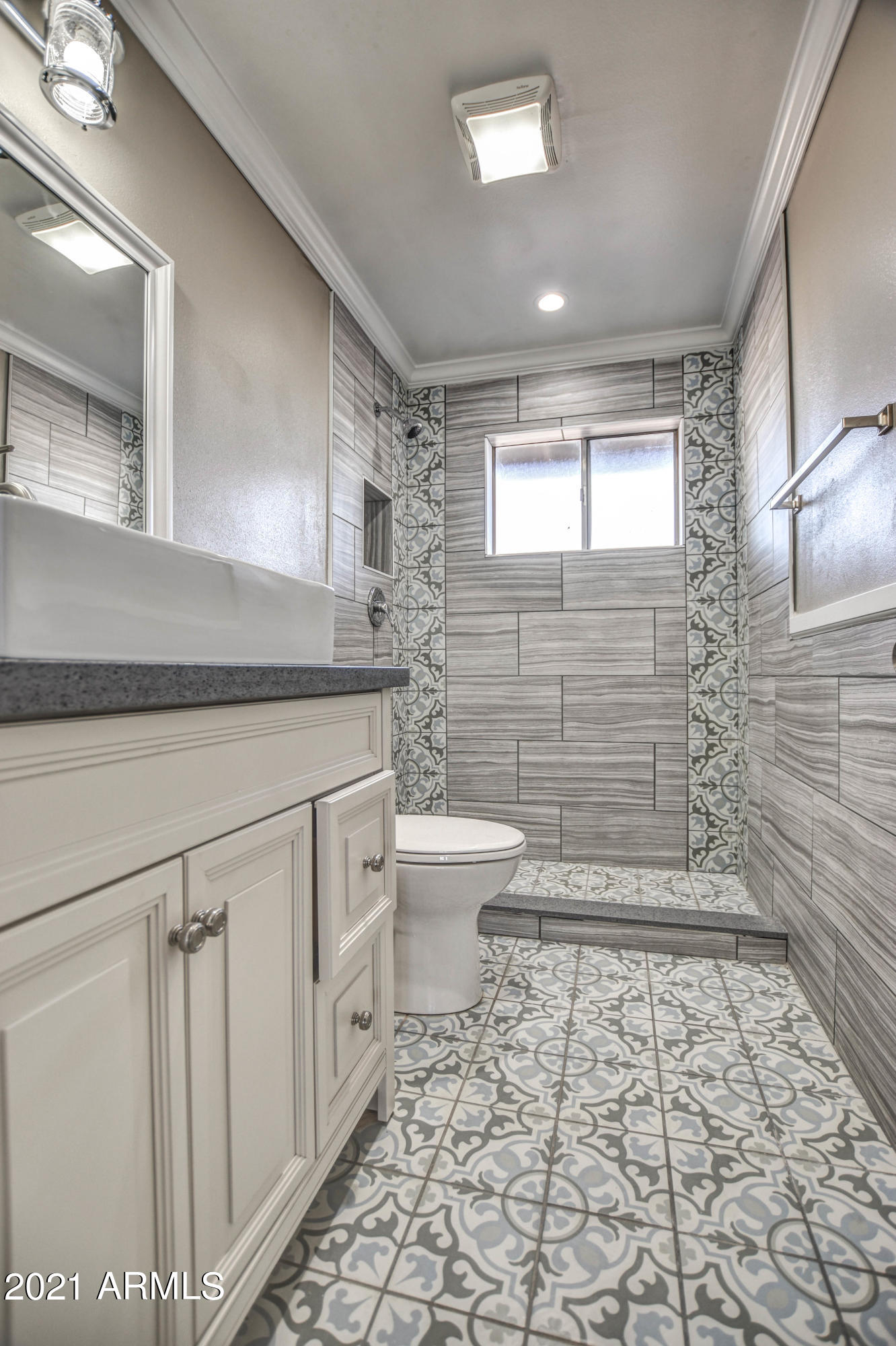 5743 Casper Road Mesa, AZ 85205 - Photo 8 of 43 a bathroom with a sink a toilet and mirror
