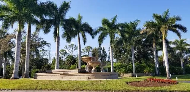 a view of a swimming pool and a yard