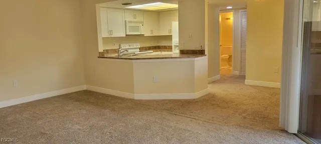 a view of a bathroom with a sink and a mirror