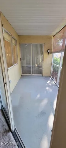 a view of an empty room with a fireplace