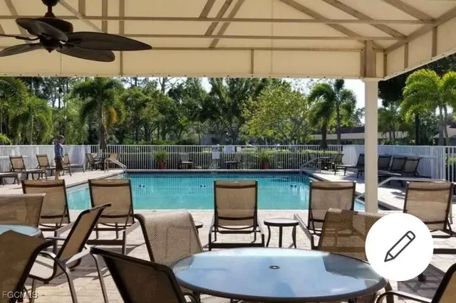 a view of a chairs and table in patio