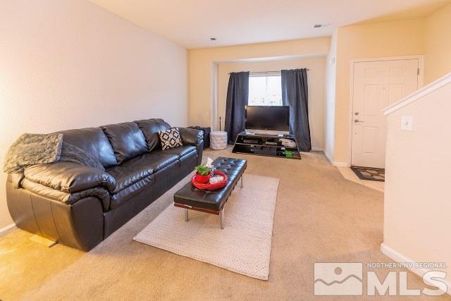 315 Dawson Jacob Lane Reno, NV 89503 - Photo 3 of 16 a living room with furniture and a flat screen tv