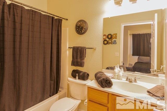 315 Dawson Jacob Lane Reno, NV 89503 - Photo 9 of 16 a bathroom with a granite countertop sink and a mirror