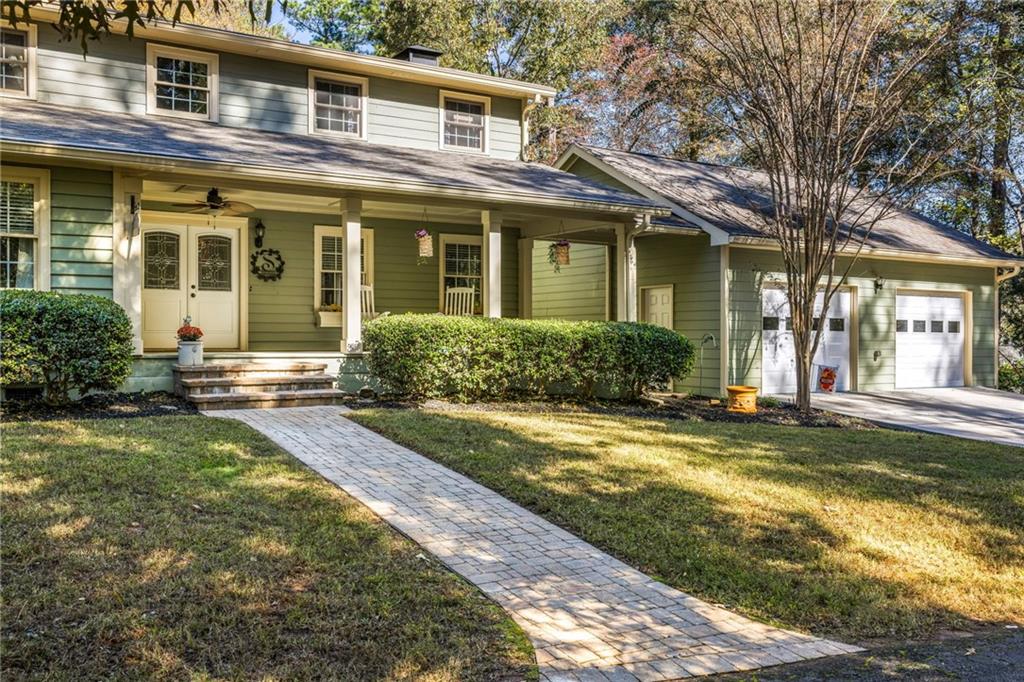 1505 Old John Ward Road Marietta, GA 30064 - Photo 2 of 46 a view of a house with a yard patio and fire pit