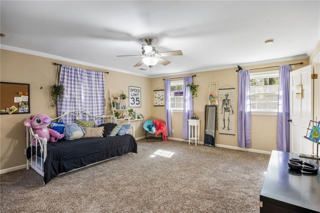1505 Old John Ward Road Marietta, GA 30064 - Photo 25 of 46 a living room with furniture gym equipment and a flat screen tv