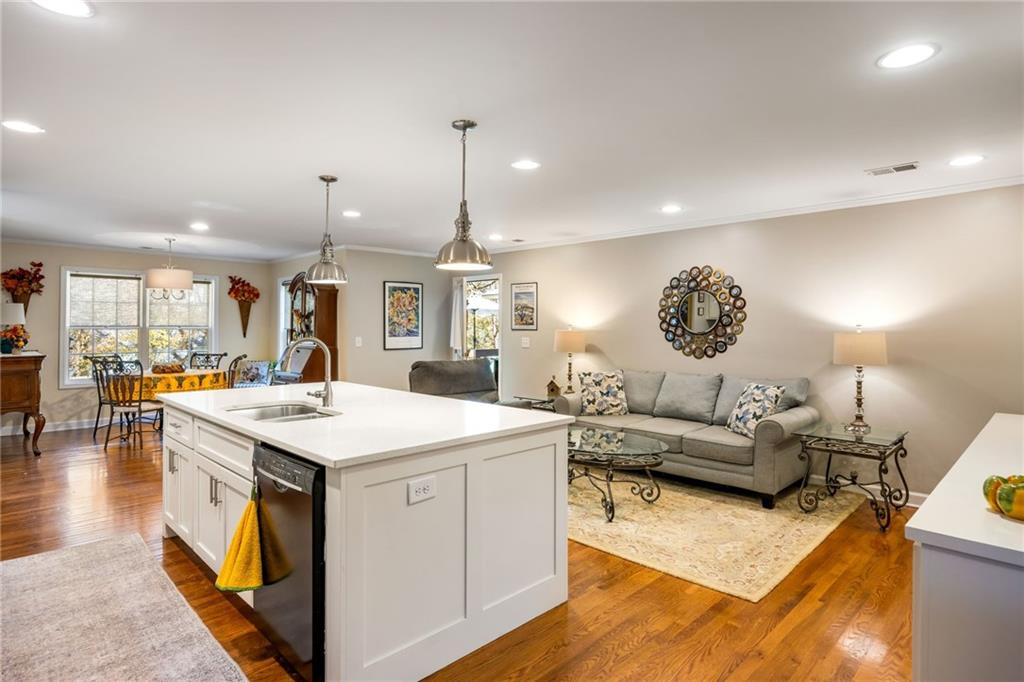 1505 Old John Ward Road Marietta, GA 30064 - Photo 29 of 46 a living room with stainless steel appliances kitchen island furniture and a view of kitchen