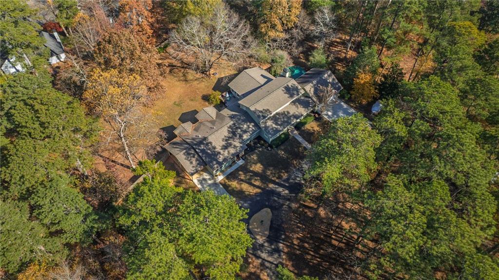 1505 Old John Ward Road Marietta, GA 30064 - Photo 41 of 46 a aerial view of a house with a yard and large trees