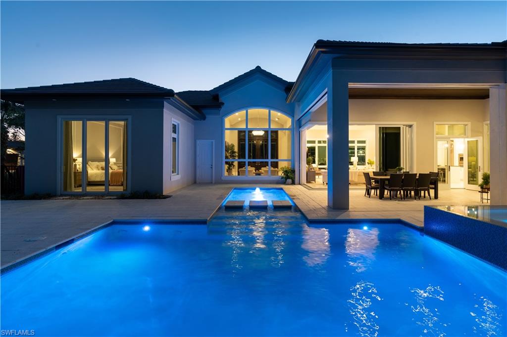 4478 Wayside Drive Naples, FL 34119 - Photo 13 of 31 a view of a living room with a chandelier