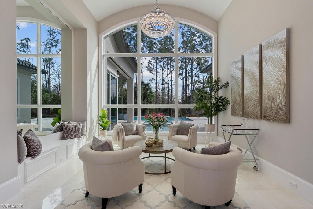 4478 Wayside Drive Naples, FL 34119 - Photo 2 of 31 a living room with furniture and a large window
