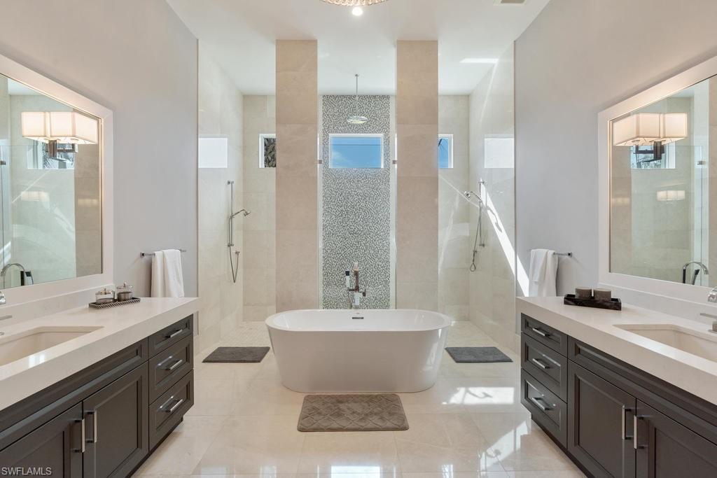 4478 Wayside Drive Naples, FL 34119 - Photo 21 of 31 a bathroom with a sink and a mirror