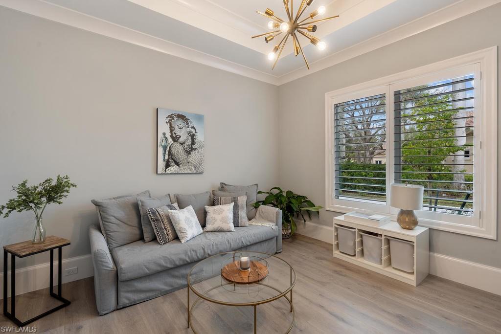 4478 Wayside Drive Naples, FL 34119 - Photo 22 of 31 a living room with furniture and a large window