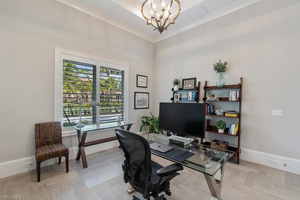 4478 Wayside Drive Naples, FL 34119 - Photo 23 of 31 a view of a livingroom with workspace and a window
