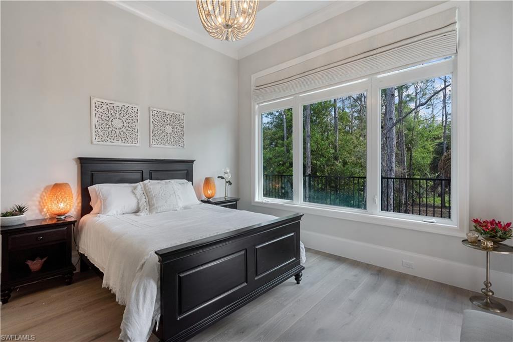 4478 Wayside Drive Naples, FL 34119 - Photo 24 of 31 a bedroom with a bed and a window