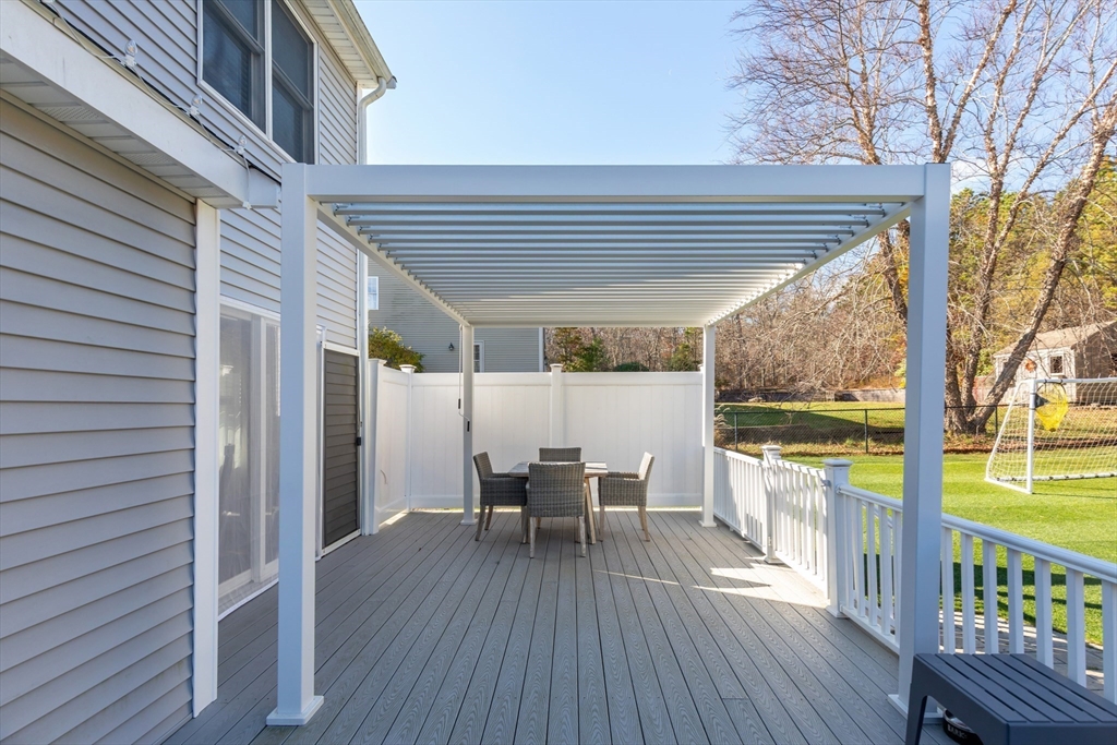 19 Oakbluff Road Bourne, MA 02562 - Photo 15 of 42 a view of a house with a patio and wooden flooring