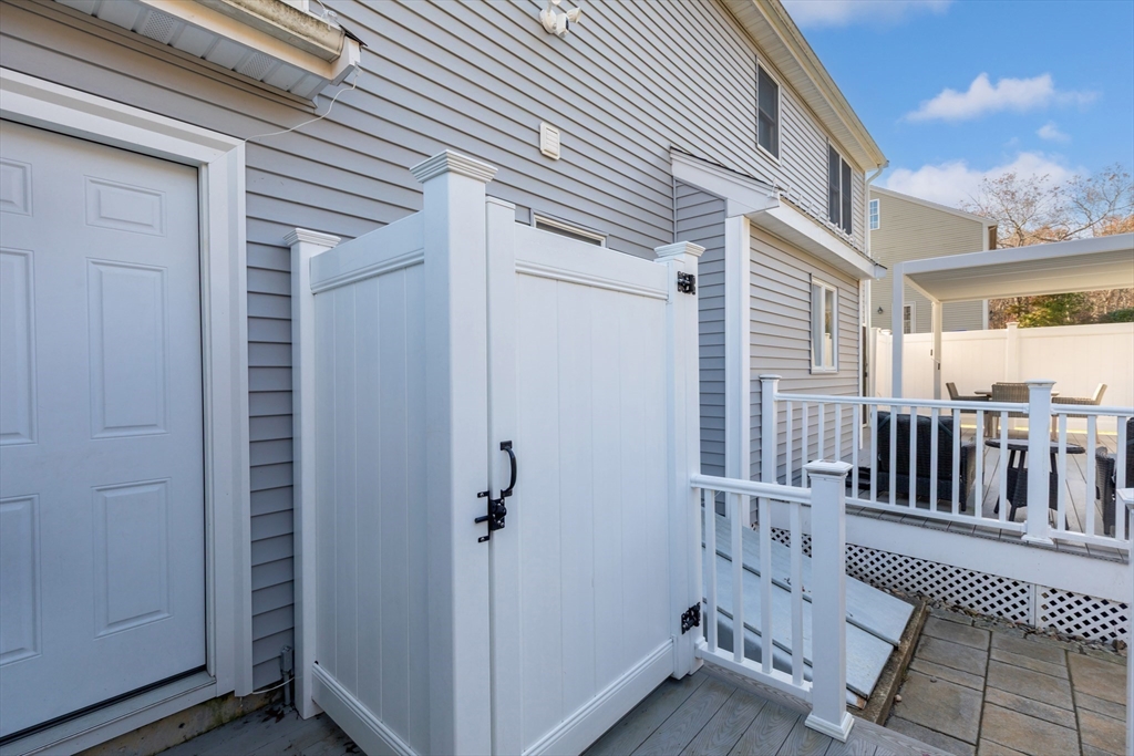 19 Oakbluff Road Bourne, MA 02562 - Photo 16 of 42 a view of a porch with wooden floor and fence