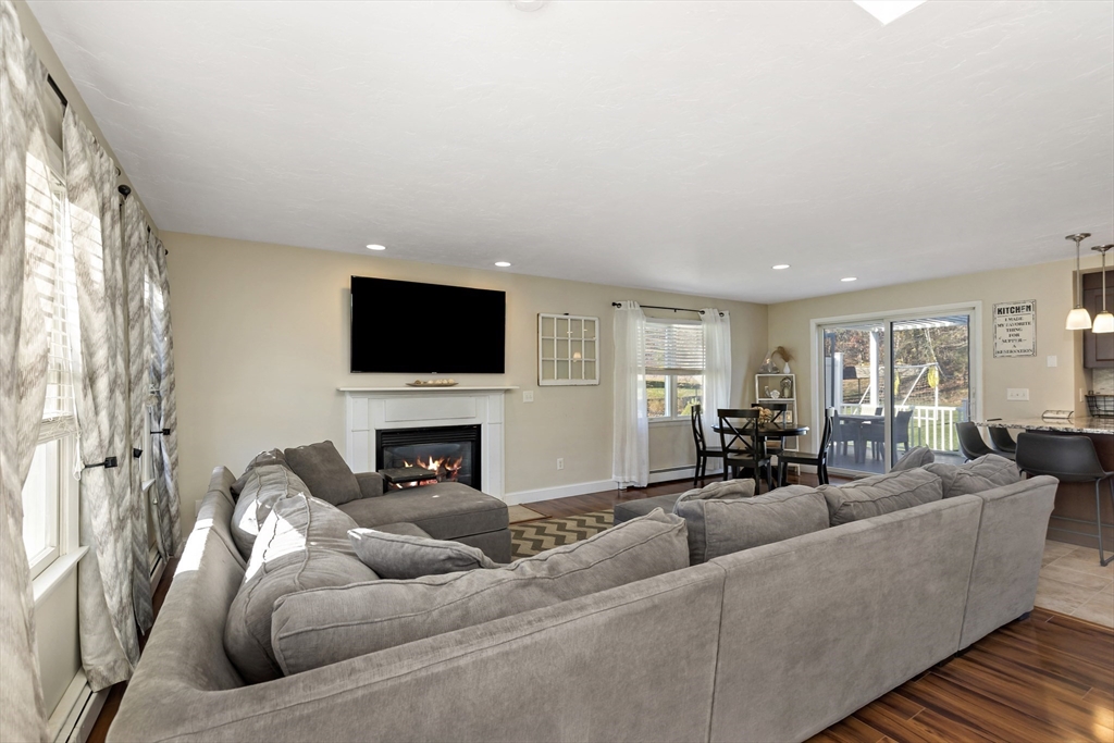 19 Oakbluff Road Bourne, MA 02562 - Photo 17 of 42 a living room with furniture and a flat screen tv