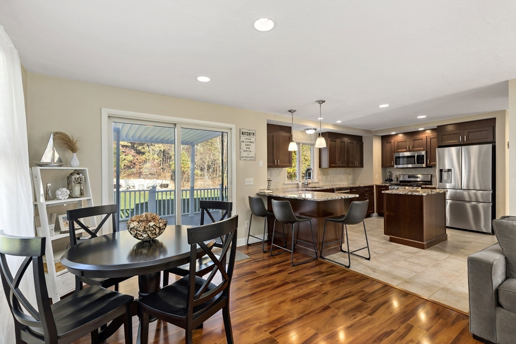 19 Oakbluff Road Bourne, MA 02562 - Photo 21 of 42 a view of a dining room with furniture and wooden floor