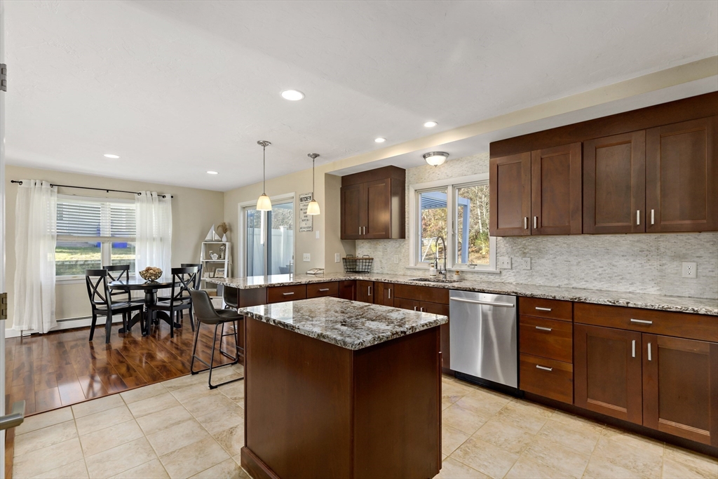 19 Oakbluff Road Bourne, MA 02562 - Photo 23 of 42 a kitchen with granite countertop a sink and stove
