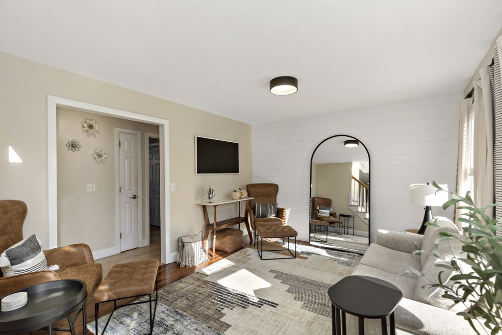 19 Oakbluff Road Bourne, MA 02562 - Photo 26 of 42 a living room with furniture and a flat screen tv