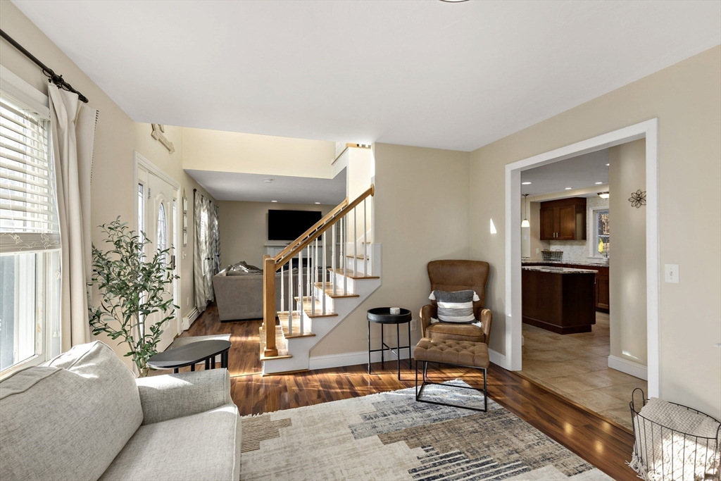 19 Oakbluff Road Bourne, MA 02562 - Photo 27 of 42 a living room with furniture kitchen view and a large window