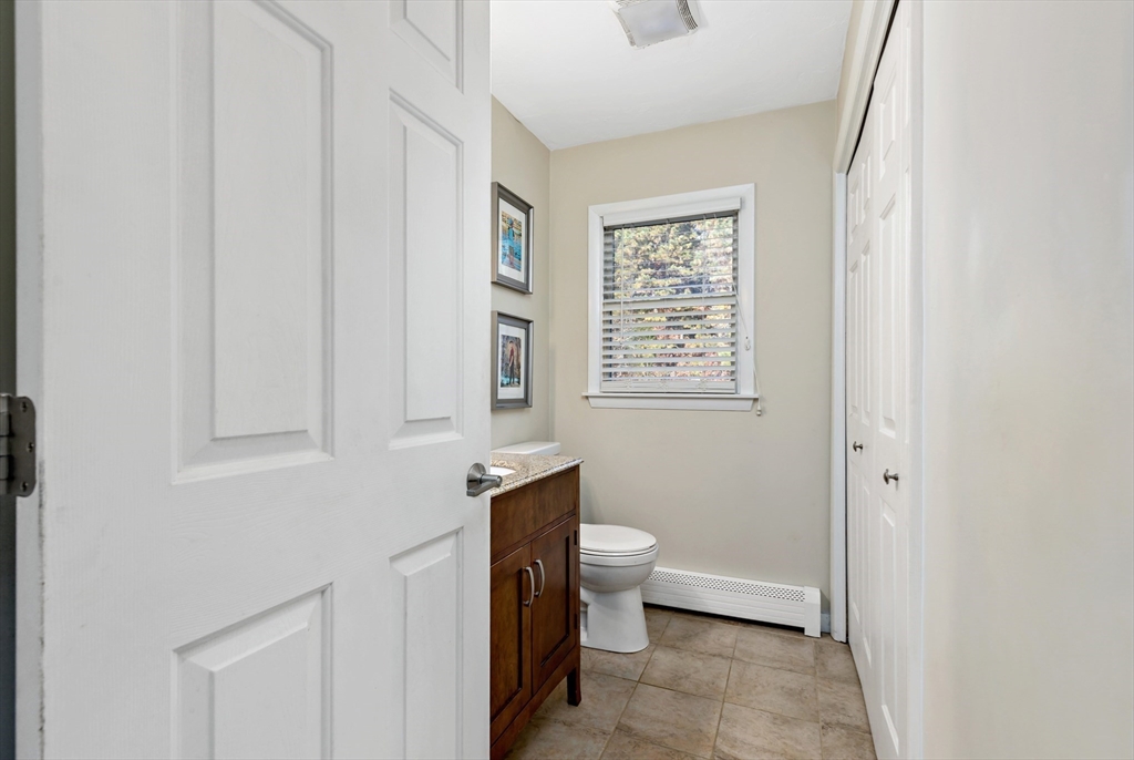 19 Oakbluff Road Bourne, MA 02562 - Photo 28 of 42 a bathroom with a toilet a sink and a window