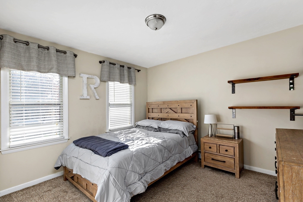 19 Oakbluff Road Bourne, MA 02562 - Photo 36 of 42 a bedroom with a bed and a tv