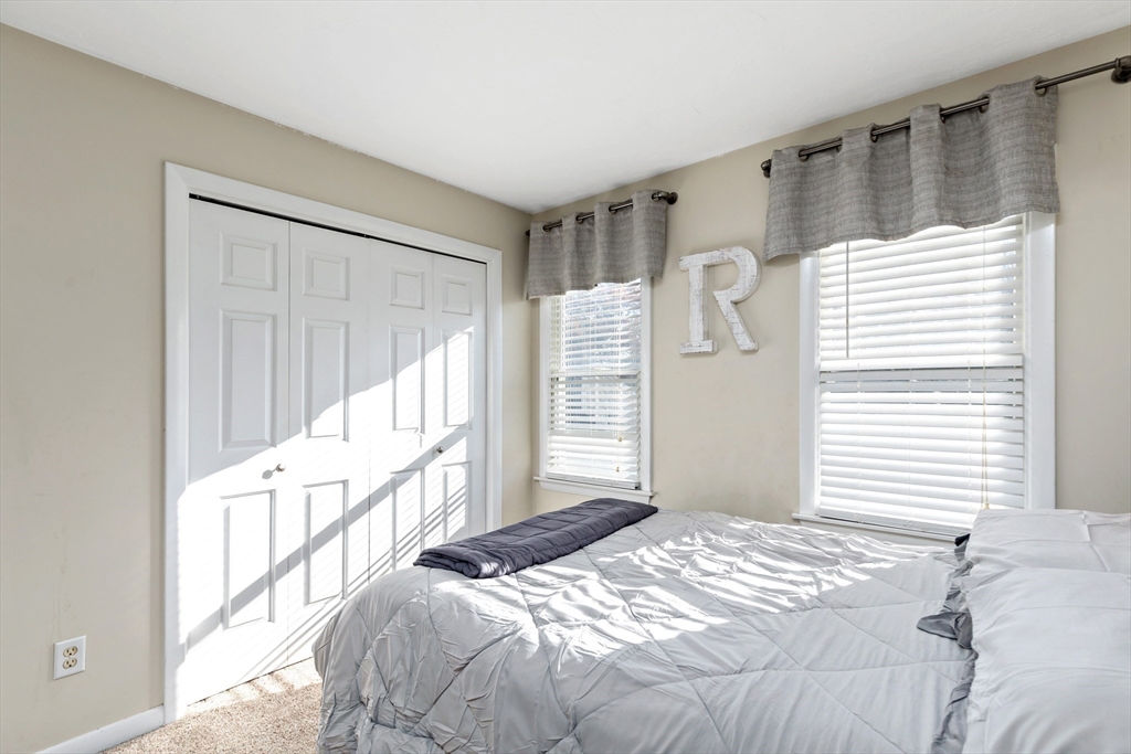 19 Oakbluff Road Bourne, MA 02562 - Photo 37 of 42 a bedroom with a bed and a window