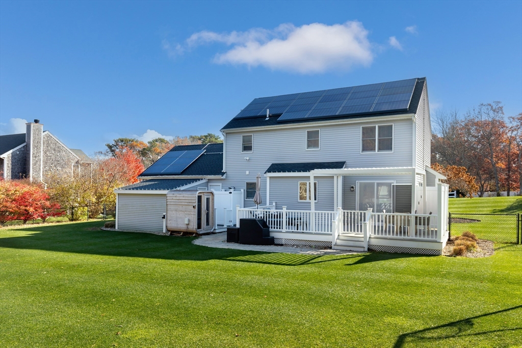 19 Oakbluff Road Bourne, MA 02562 - Photo 4 of 42 a front view of a house with a garden