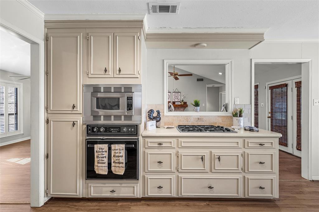 3601 Willow Bend Circle Waco, TX 76708 - Photo 12 of 37 a kitchen with stainless steel appliances granite countertop a stove and a microwave