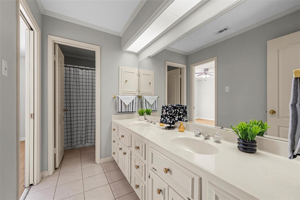 3601 Willow Bend Circle Waco, TX 76708 - Photo 25 of 37 a bathroom with a sink a potted plant and a mirror